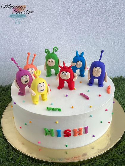 We had so much fun creating all seven characters for this Oddbods themed cake. Each figure is handmade from fondant, bringing their unique personalities to this colorful and playful birthday cake.