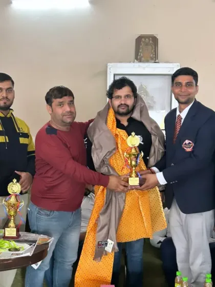 Being felicitated at a martial arts event. It is an honor to be recognized for my contribution to coaching and the sport of karate.