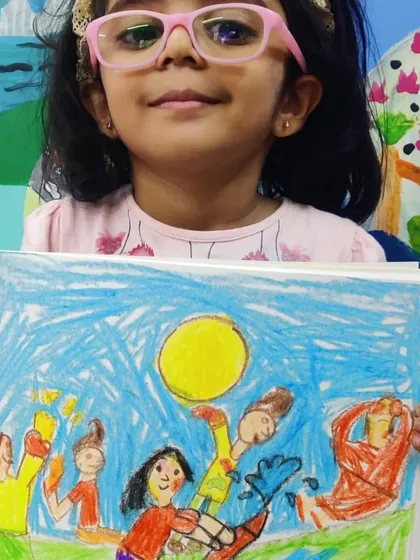 A vibrant drawing capturing the fun of Holi. The artist used bright colours to show people playing with water and colours under a big yellow sun, perfectly conveying a festive and joyful mood.