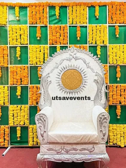 A majestic silver and white throne for the mom-to-be, set against a vibrant marigold checkered backdrop. This high-back chair makes the guest of honor feel like a queen.