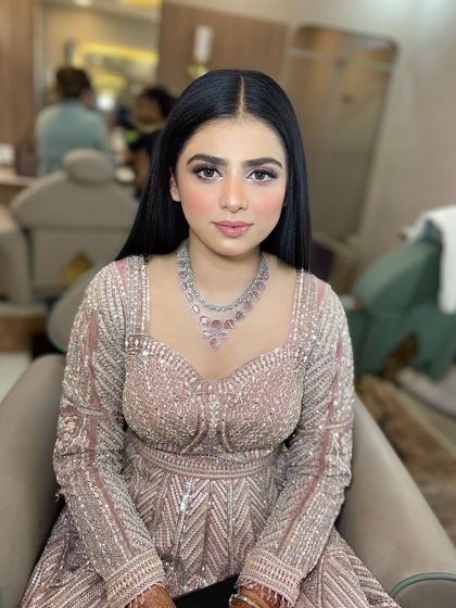 My beautiful and cute engagement bride. We opted for a soft glam look with a shimmery lilac eyeshadow and sleek, straight hair.