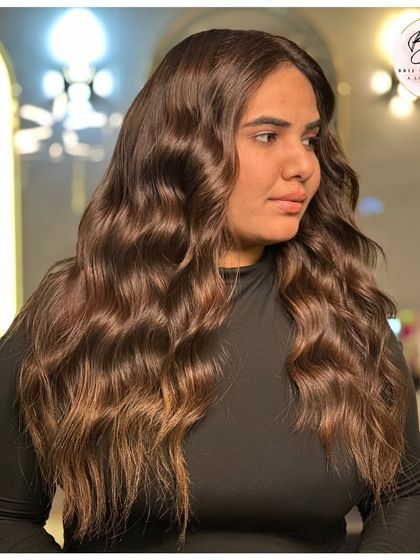 This look is all about transforming strands and moods. The rich brown color is an upgrade to the client's whole aura.