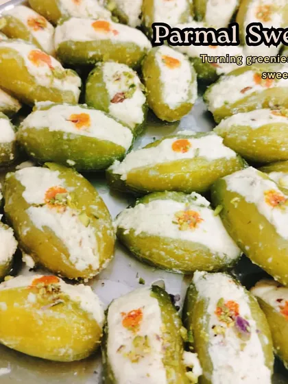 This is our special Parmal Sweet, a unique delicacy. Pointed gourds (parmal) are stuffed with a sweet khoya and nut filling, offering a surprising and delicious combination of flavors.