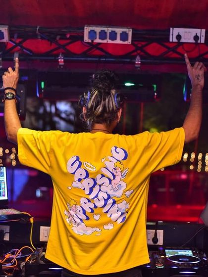 Let's rise and shine. A view from the back, with my hands up, ready to lift the energy of the entire room.