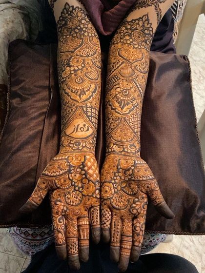 A full bridal mehendi set, complete with personalized names hidden in the design.