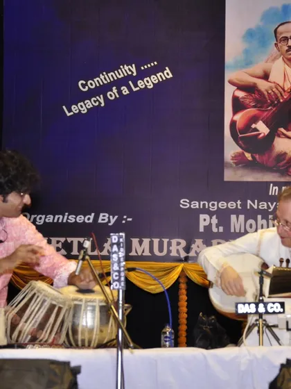 On stage with Ken Zuckerman ji, paying tribute to a legend in the backdrop. He taught me that one must strive to improve their music until the very last concert.