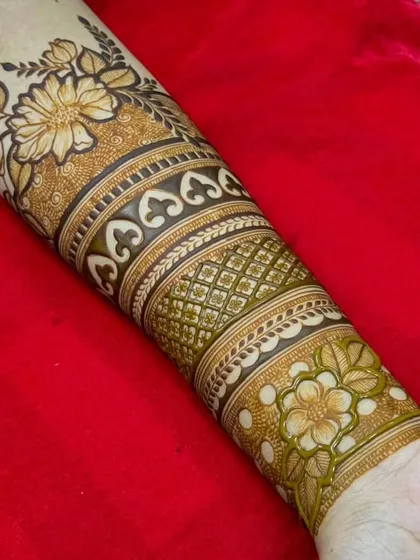 A beautiful floral band design on the arm, using shading and bold outlines to create a stunning, modern look.
