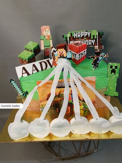 A Minecraft-themed fire cake, where the top layer burns to reveal the game's iconic imagery.