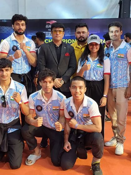 Our team with an official at the MMA National Championship, representing our club on the national stage.