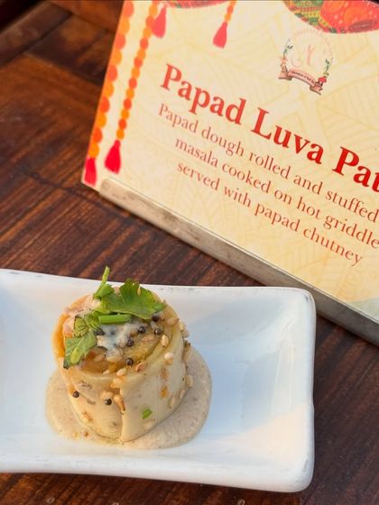 Papad Luva Pato, a unique snack where papad dough is rolled, stuffed with masala, and cooked on a griddle. It's a testament to the endless creativity within Indian regional cuisines.