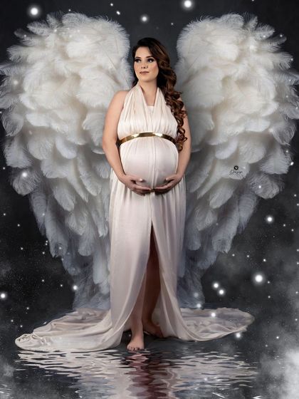 Another take on the angel wings theme, this portrait has a magical, ethereal feel. The white gown, starry night effect, and water reflection combine to create a beautiful fantasy image.