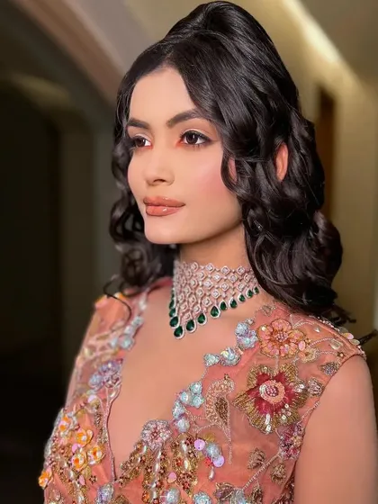 Another beautiful close-up, showcasing the soft, romantic makeup and the intricate details of the blouse.