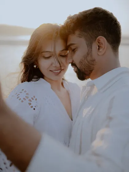 An intimate selfie-style shot taken by the couple themselves, which I then captured. The close-up perspective and their gentle expressions make this a very personal and sweet image.