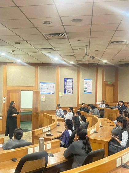 The tiered classroom setup allows for great interaction. Here, I am addressing a question from the audience during a POSH compliance workshop.