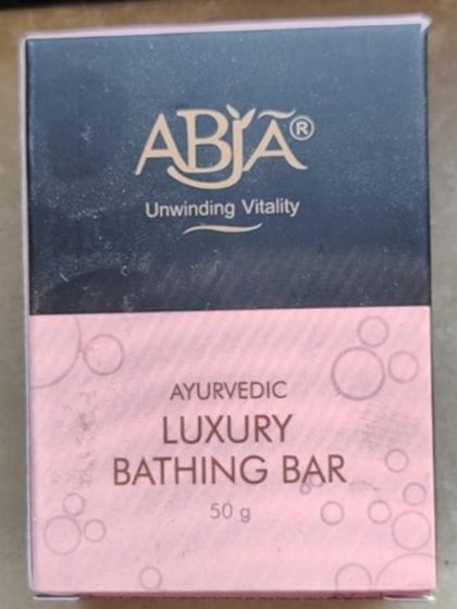 The packaging of my Ayurvedic Luxury Bathing Bar, a 50g soap made with natural herbs for a gentle cleansing experience.