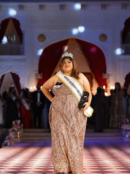 The winner of the plus-size pageant, looking radiant in a rose gold gown. It was an honor to be a part of her journey.
