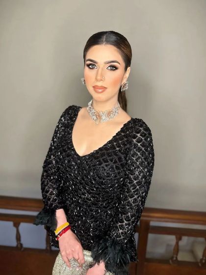 A close-up of the sleek high ponytail, a perfect choice for a glamorous reception or cocktail party look.