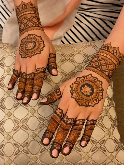 A classic back-hand design with lotus mandalas. The simple, clean look is perfect for someone who wants an elegant design that isn't too heavy.
