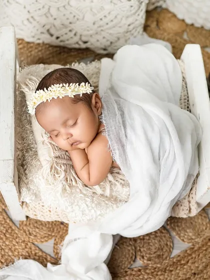 To the most beautiful little girl. This portrait showcases my love for clean, bright, and airy setups with natural textures like jute and soft white fabrics.