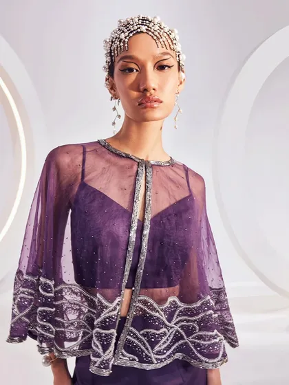A close-up of the Zoey Cape Set, showing the delicate wave-like embellishments on the sheer purple organza, perfect for any glamorous affair.