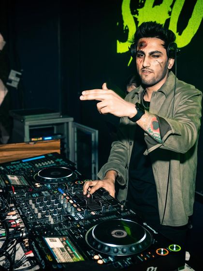 In character for a Halloween gig, complete with stage makeup. I don't just play music for themed parties; I become part of the theme myself.