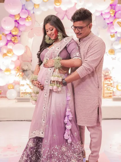A loving moment captured at the baby shower, with the soft hairstyle looking perfect from every angle.