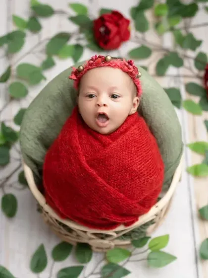 A cute, wide-eyed and yawning pose from our red rose-themed shoot.