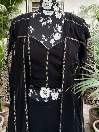 The matching embroidered bustier completes this three-piece set.
