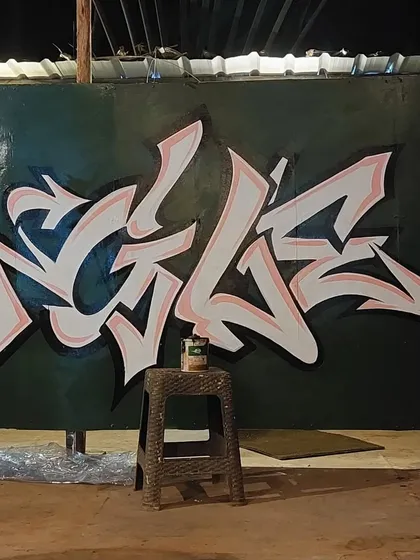A clean and sharp calligraffiti piece I painted in Goa. The lettering has a vibe that is both edgy and stylish, perfect for the chill atmosphere of the jungle-themed space.