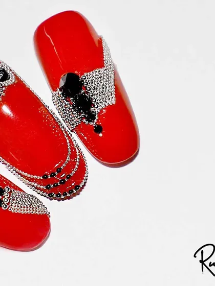 A close-up of the red and black jewellery design.