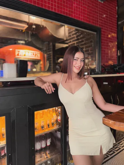 Posing by the pizza oven in the chic and simple slip dress.