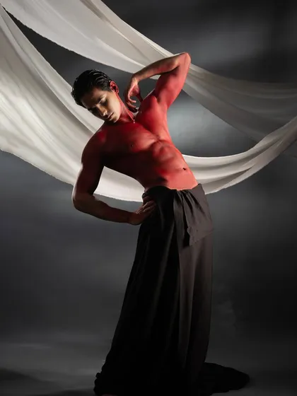 This dynamic pose showcases how the red body paint moves with the body, maintaining its vibrant color and smooth finish.