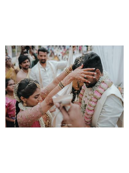 A close-up of the 'talambralu' ritual, a key moment in many South Indian weddings.