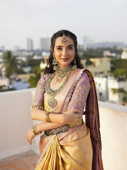 A full-length shot on a rooftop, this image showcases the complete look against a modern city backdrop.