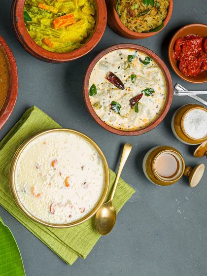 We serve a wide variety of authentic regional Indian meals, from Chettinad to Kerala specials. This spread showcases some of our popular curries and payasam, all served in traditional earthenware to keep the flavors intact.
