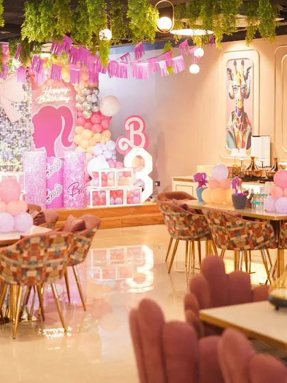 A wide shot of our dining area decorated for a Barbie-themed birthday. We transform the entire space to match your chosen theme perfectly.