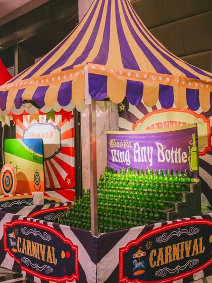 Classic carnival games like 'Ring Any Bottle' are a must-have for a circus theme. I provide these custom-built stalls to create an authentic and interactive fairground experience for guests of all ages.