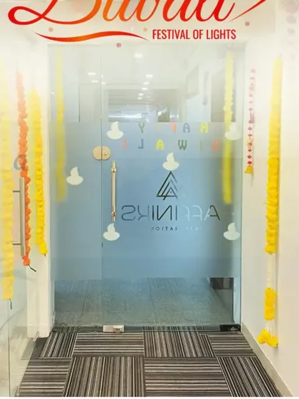 Bringing the festival of lights to the office. We decorated this entrance with traditional marigold garlands and diya decals on the glass door to welcome everyone with the warmth of Diwali.