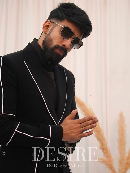 A black blazer is a staple, but mine are never basic. This one features clean white piping that traces the lapels and pockets, adding a graphic, modern edge to a timeless piece.