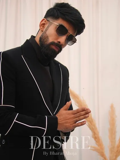 A black blazer is a staple, but mine are never basic. This one features clean white piping that traces the lapels and pockets, adding a graphic, modern edge to a timeless piece.