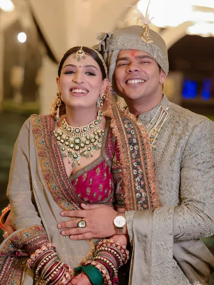 It's all about that happy couple glow. I love creating complementary looks, not matching ones. For Yashika and Sanyam, we chose a regal, multi-toned lehenga for her and a custom sage green sherwani for him, ensuring they both looked incredible together.