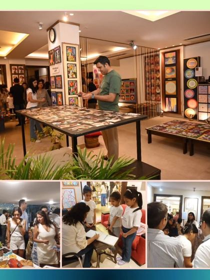 Our exhibition is an interactive experience, with guests enjoying refreshments, signing our guest book, and taking a close look at the detailed artwork on display.