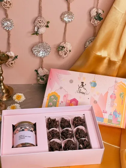 My Diwali hampers are designed to bring a sparkle to your celebrations. This beautiful box features crunchy Almond Rochers and a jar of my classic Vanilla Choco-chip Cookies, all packed in festive-themed packaging.