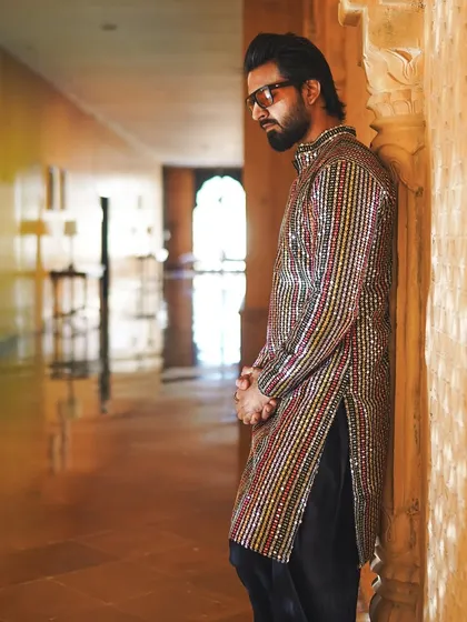 Lost in thought in a majestic palace corridor. These moments of quiet reflection are just as important as the loud celebrations.