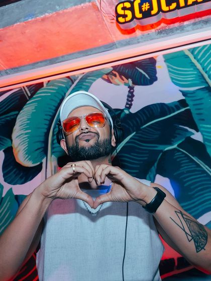 Spreading the love from behind the decks. My heart is in the music, and I share it with everyone on the dance floor.