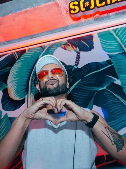 Spreading the love from behind the decks. My heart is in the music, and I share it with everyone on the dance floor.