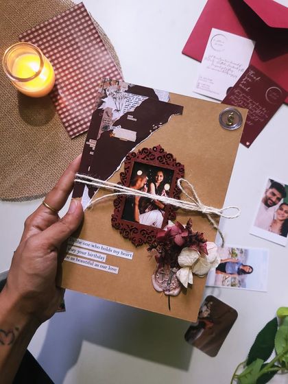I love how this flap book came together. The cover features a framed photo and dried flowers, tied with twine for a rustic feel. It’s a beautiful package for all the memories held inside.