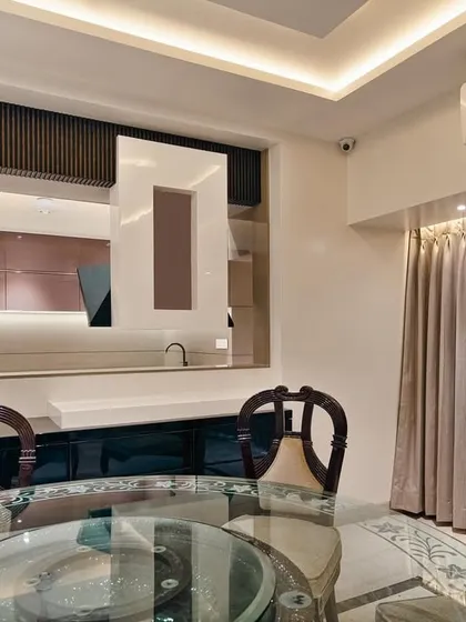 A view from the dining area into the kitchen at our Malad project. The open-concept design creates a cohesive living space, perfect for family interaction and entertaining.