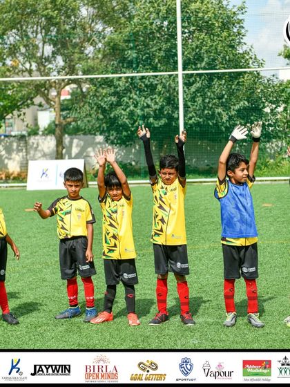 The team waves to the crowd, full of confidence and ready for the game.
