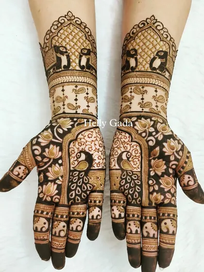 For a truly unique and artistic look, I created this design featuring penguins under a traditional arch, paired with peacock and elephant motifs. This shows how we can blend traditional patterns with personalized, modern themes to create something unforgettable.